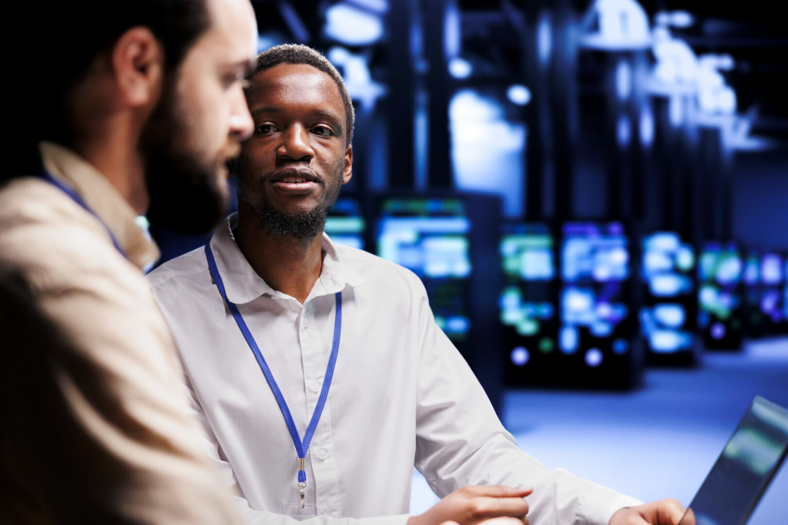 IT developers collaborating to address server system failures and prevent data center downtime.