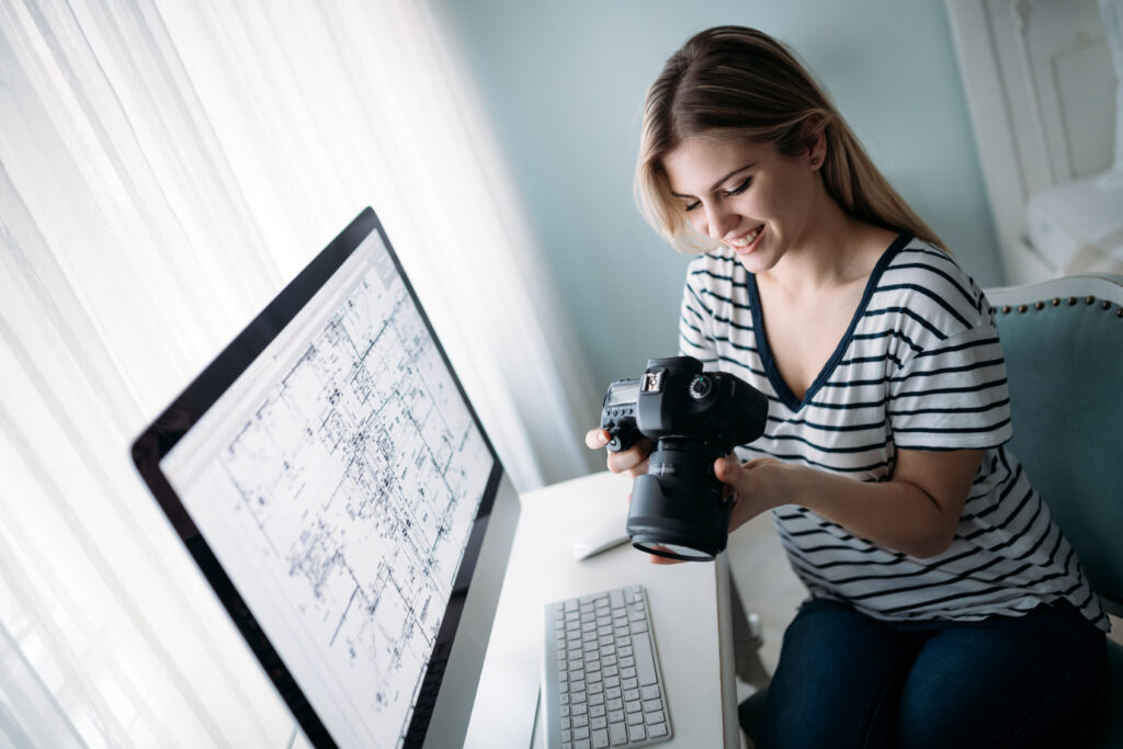 Alt Text: Young attractive designer working on project at home